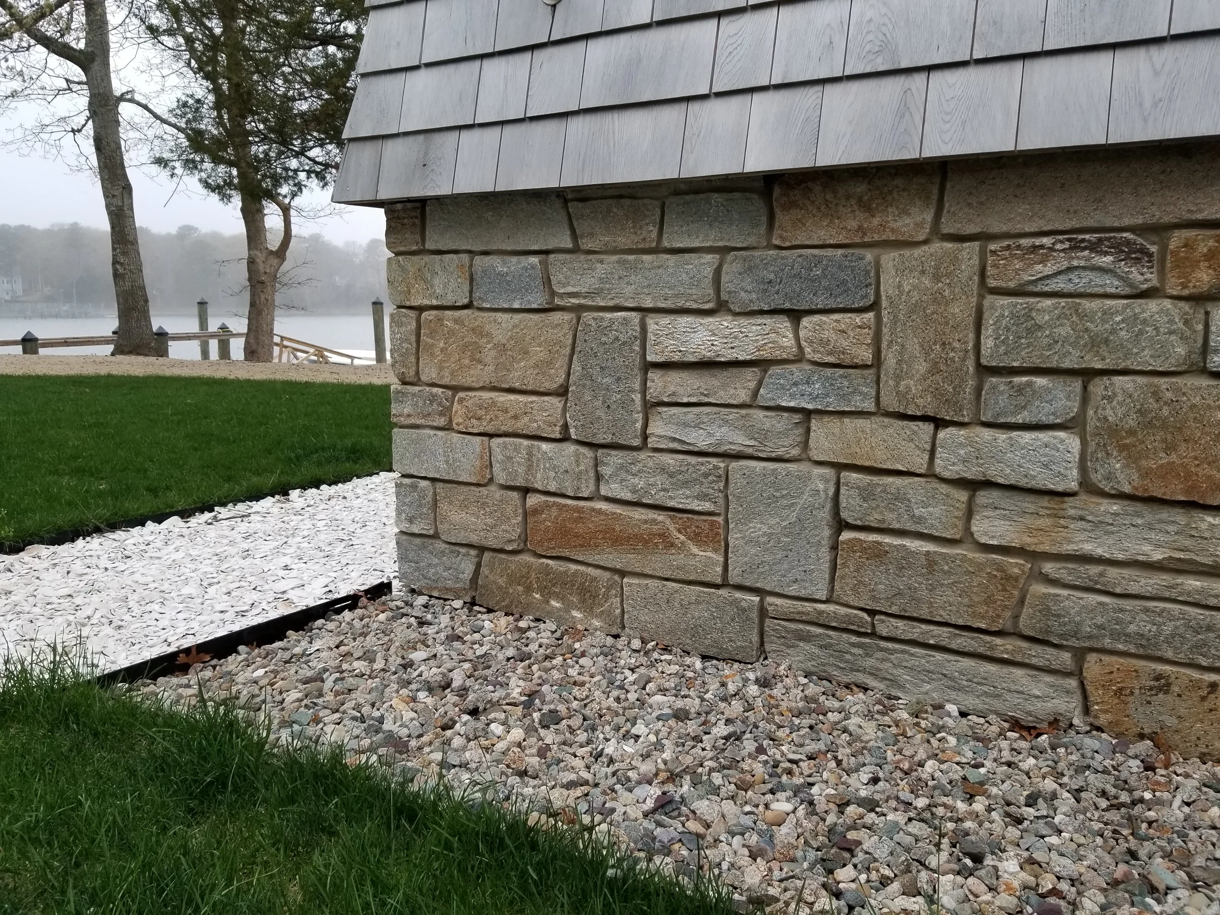 Close view of coursed natural stone masonry