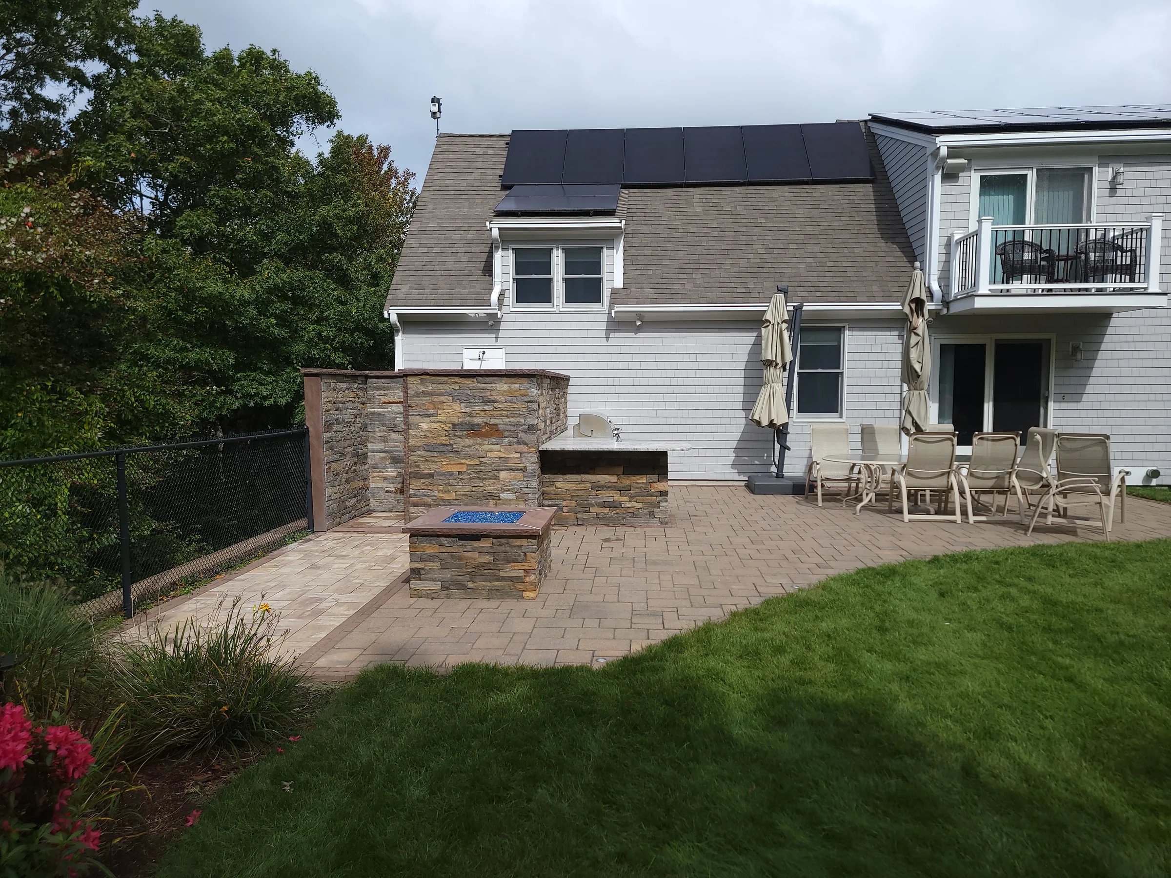 Tiered backyard terrace with masonry feature walls
