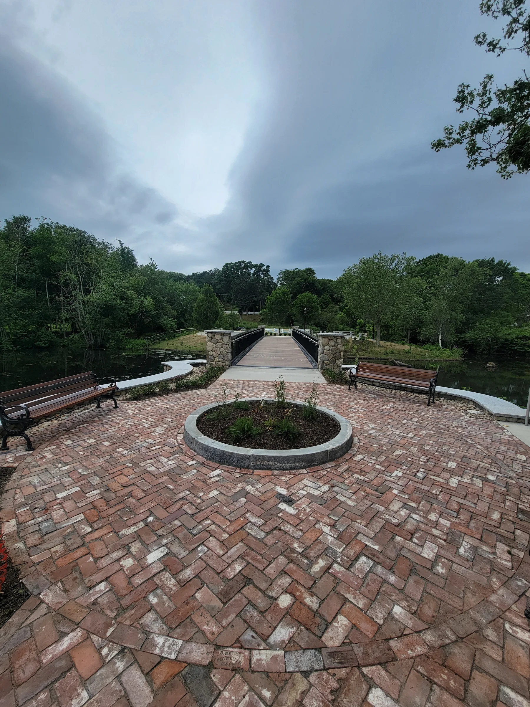 Circular brick plaza and path in a public landscape